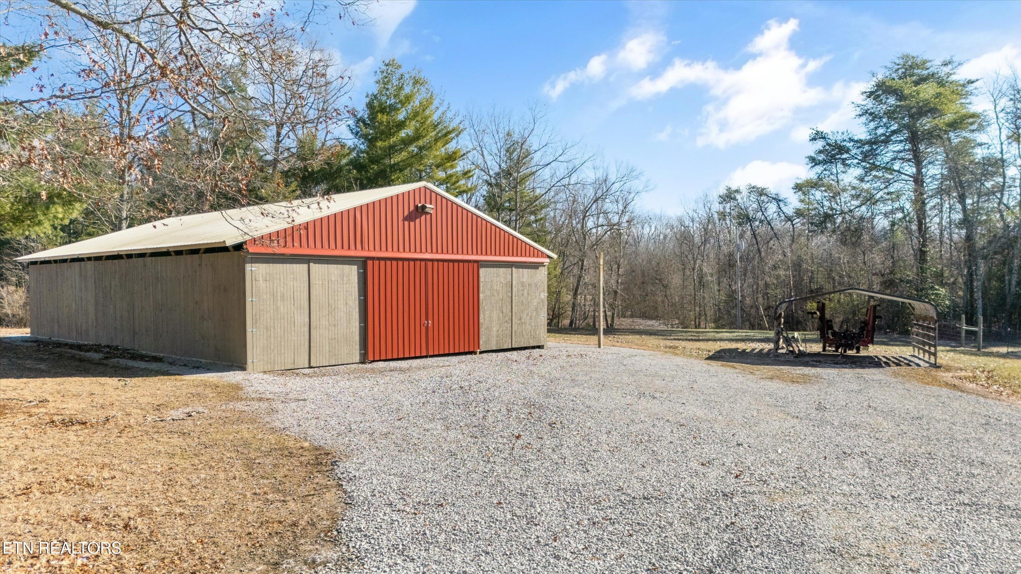 1752 Hillendale Road Crossville, TN 38572 - Photo 42 of 60 a view of a barn with a small yard and large trees