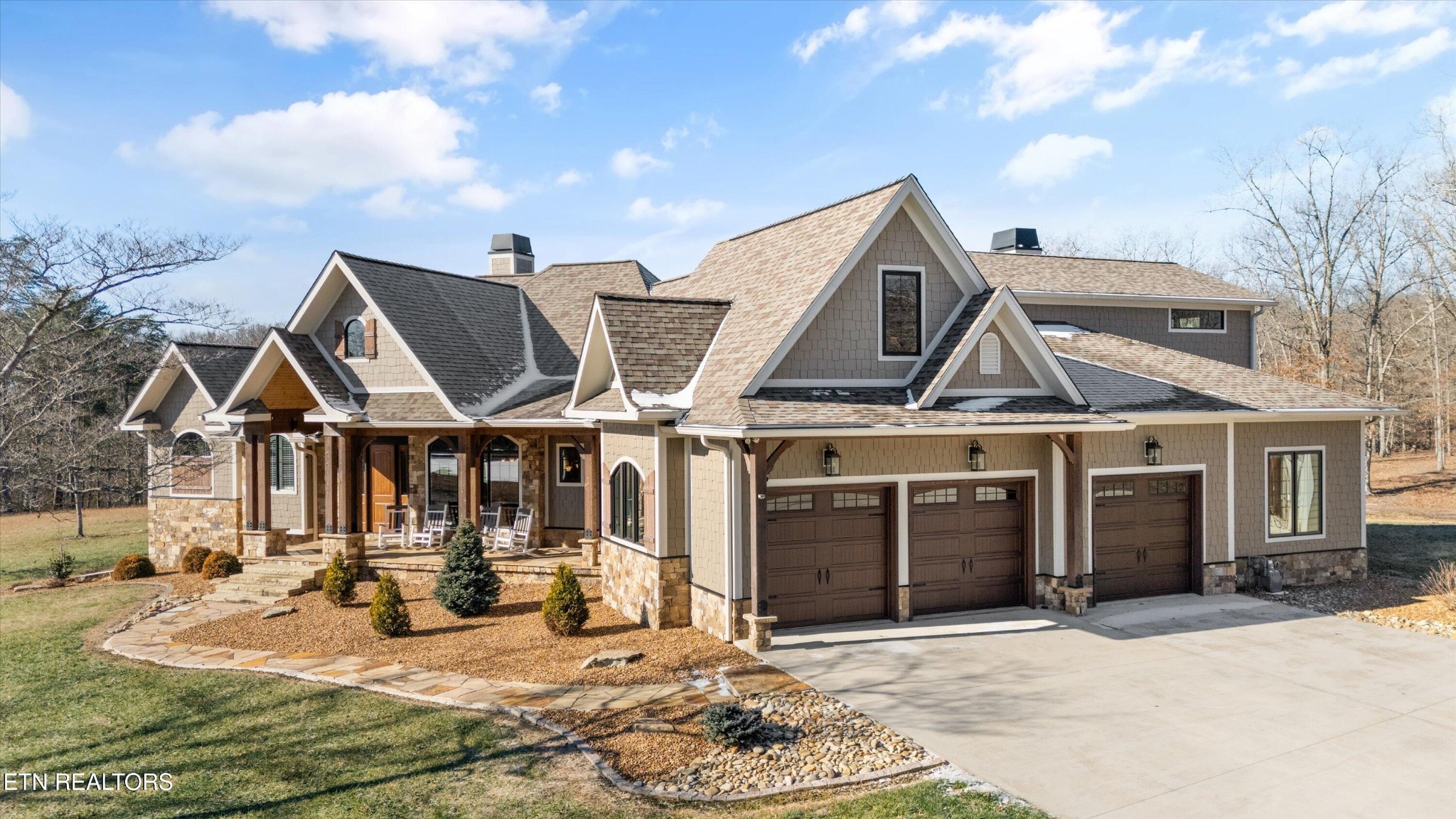 1752 Hillendale Road Crossville, TN 38572 - Photo 55 of 60 a view of a white house with large windows next to a road