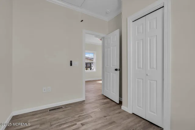 a view of a bathroom with wooden floor
