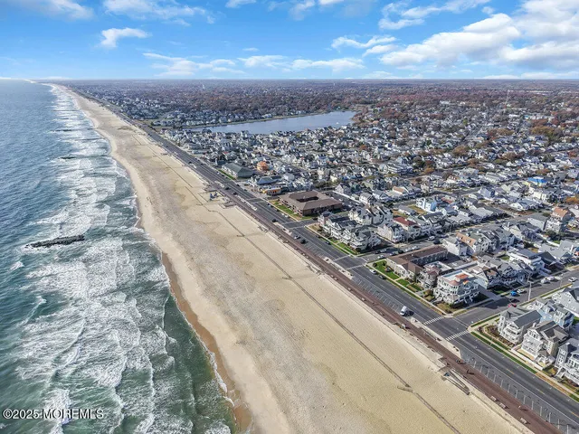 an aerial view of city and mountain view in back