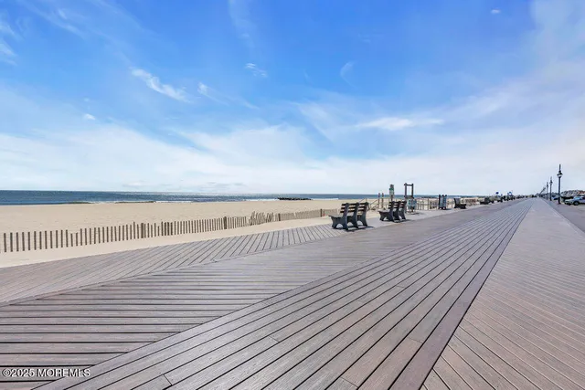 an aerial view of a house yard swimming pool and outdoor seating