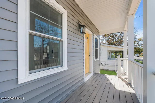 a view of a house with a wooden deck