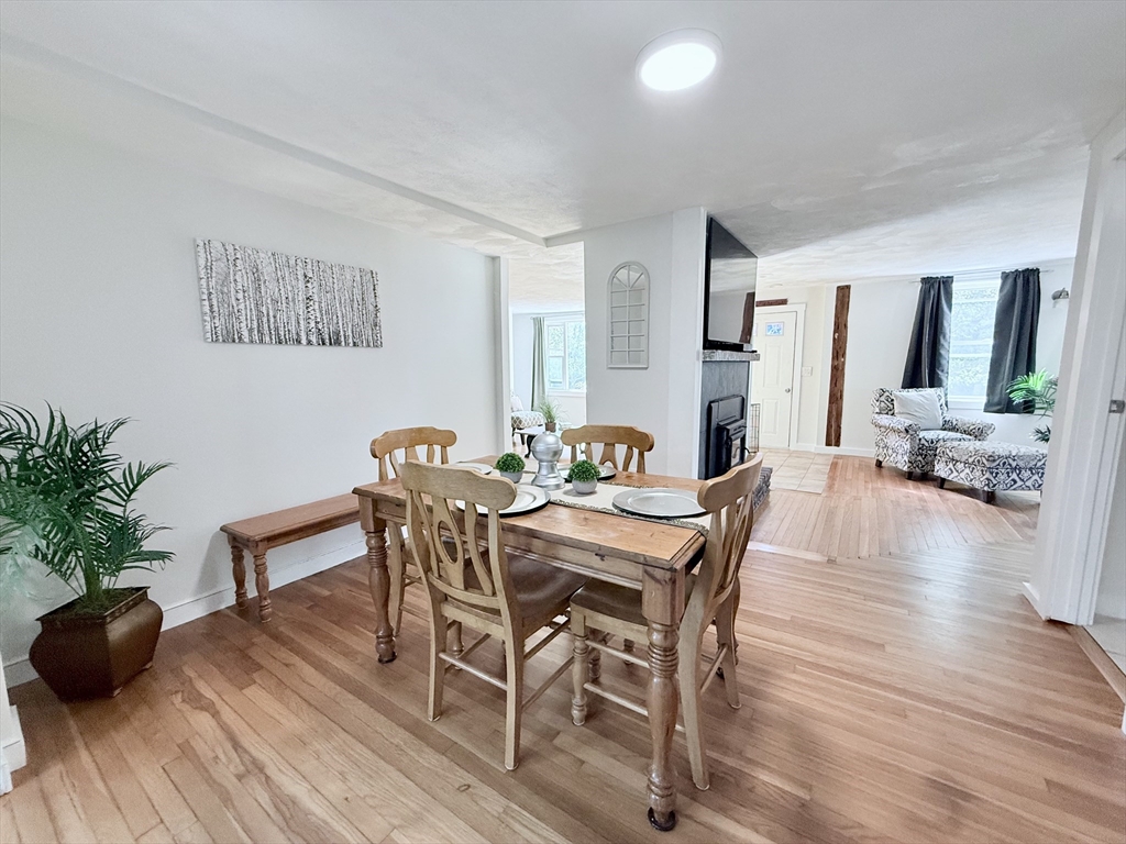 975 South Main Street Bellingham, MA 02019 - Photo 26 of 38 a view of a dining room with furniture and wooden floor