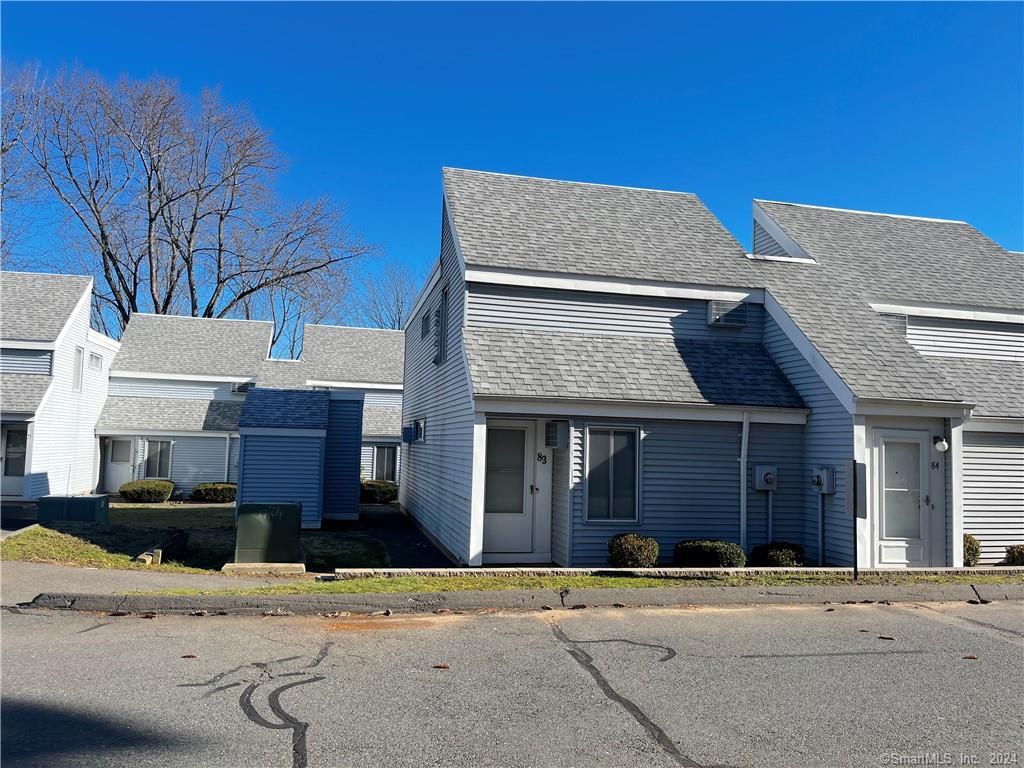 a brick house with a large windows
