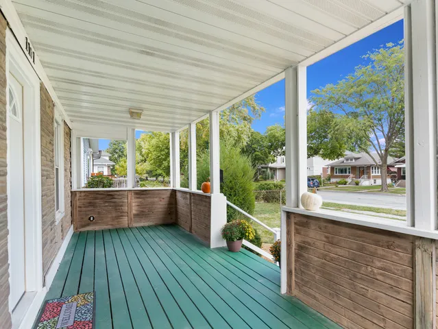 a view of a room with wooden floor and outdoor space