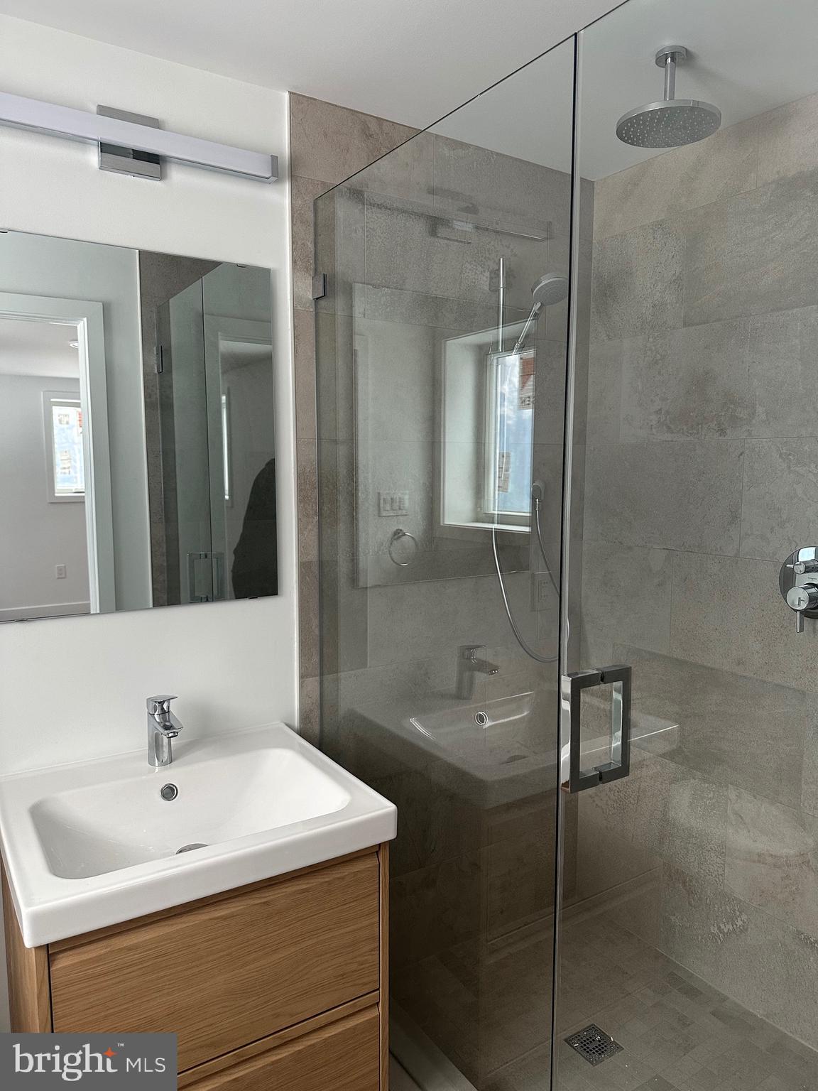 713 Woodfield Road Villanova, PA 19085 - Photo 19 of 33 a bathroom with a sink a toilet and shower