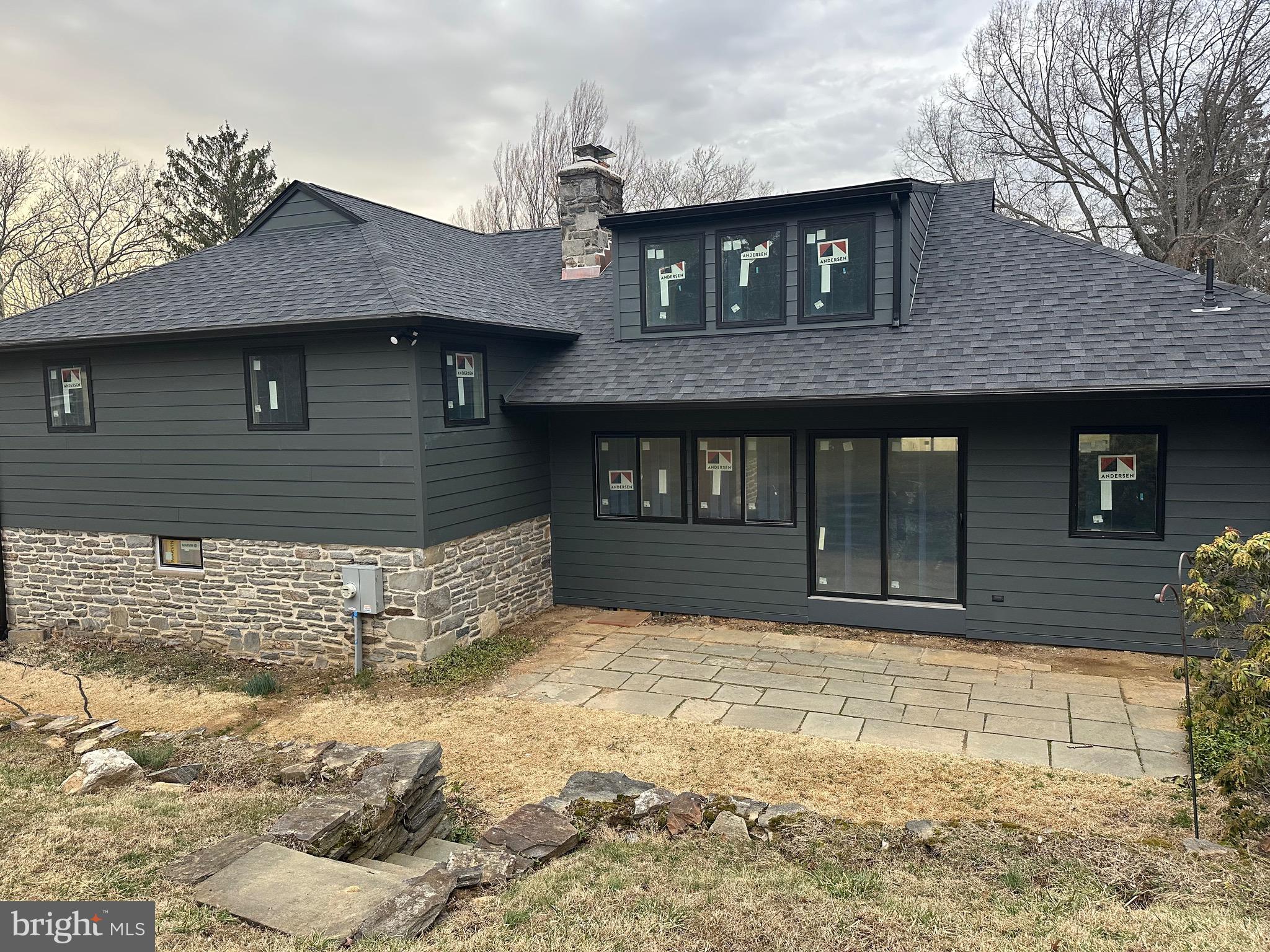 713 Woodfield Road Villanova, PA 19085 - Photo 2 of 33 private backyard with blue stone patio