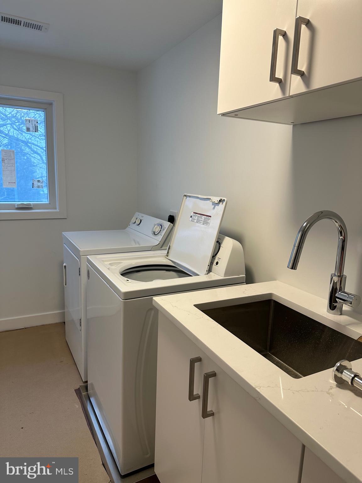 713 Woodfield Road Villanova, PA 19085 - Photo 22 of 33 a utility room with dryer and washer