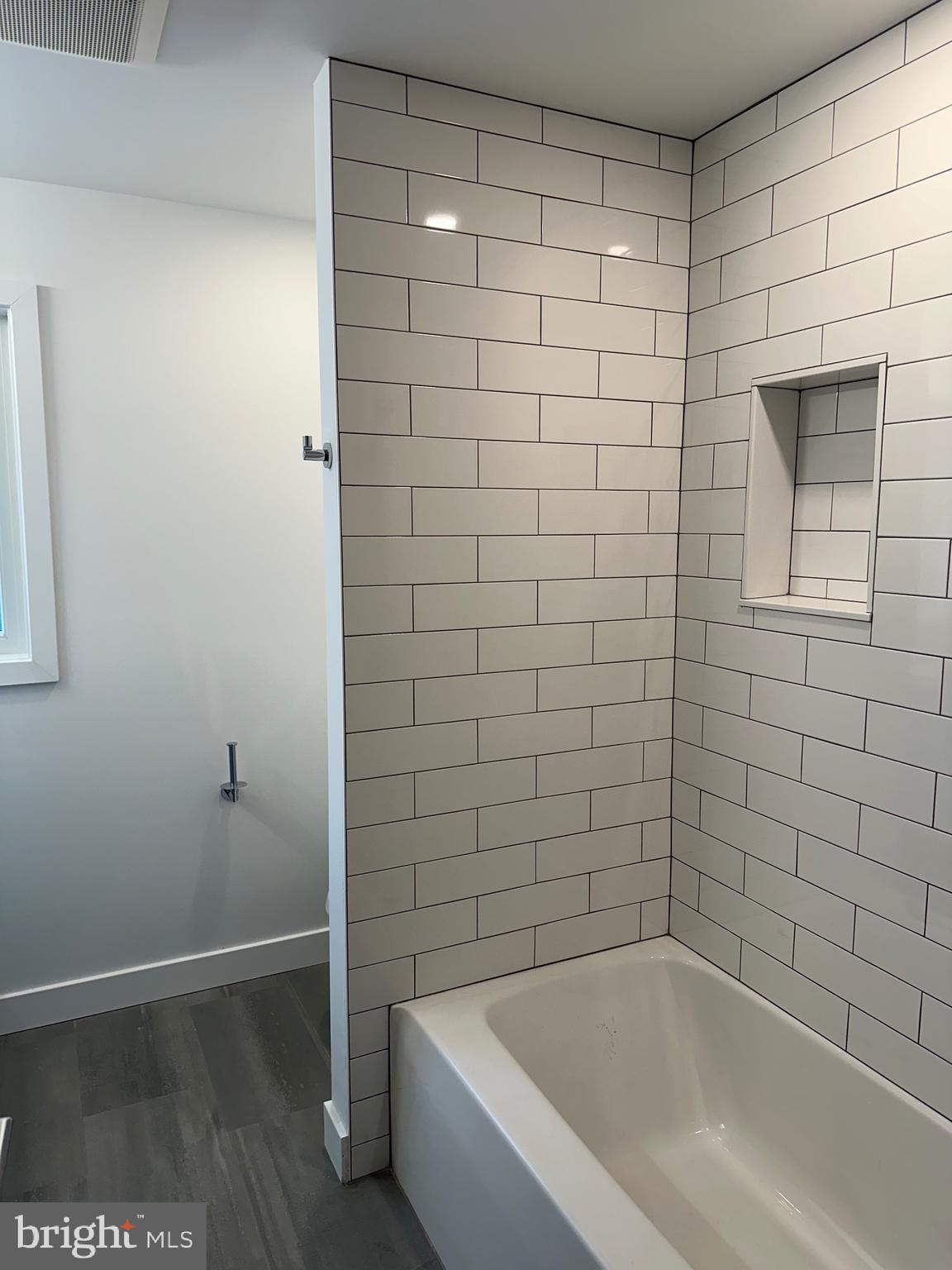 713 Woodfield Road Villanova, PA 19085 - Photo 24 of 33 a bathroom with a bathtub