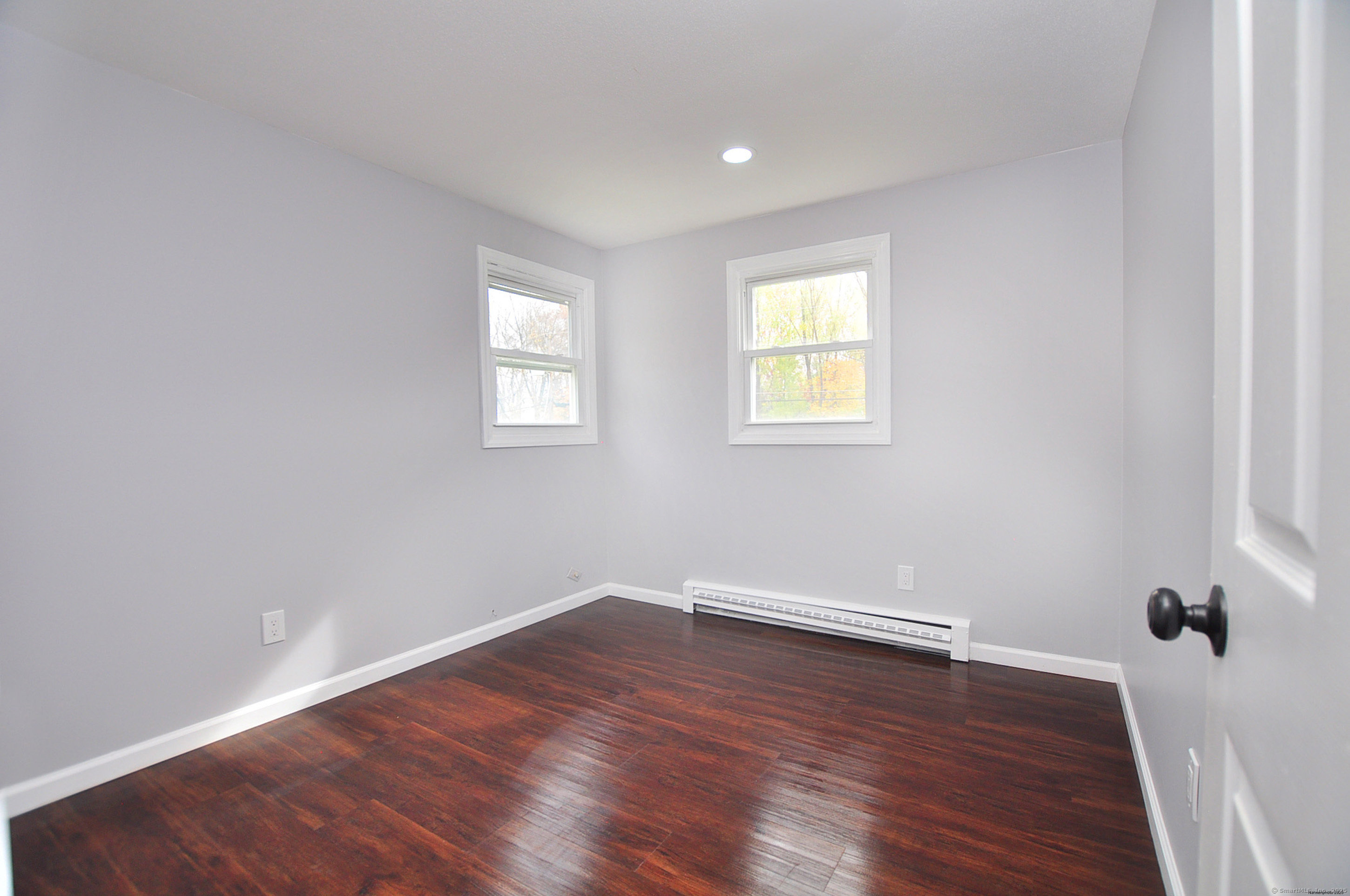 4 Kimann Drive Plymouth, CT 06786 - Photo 12 of 25 wooden floor in an empty room with a window