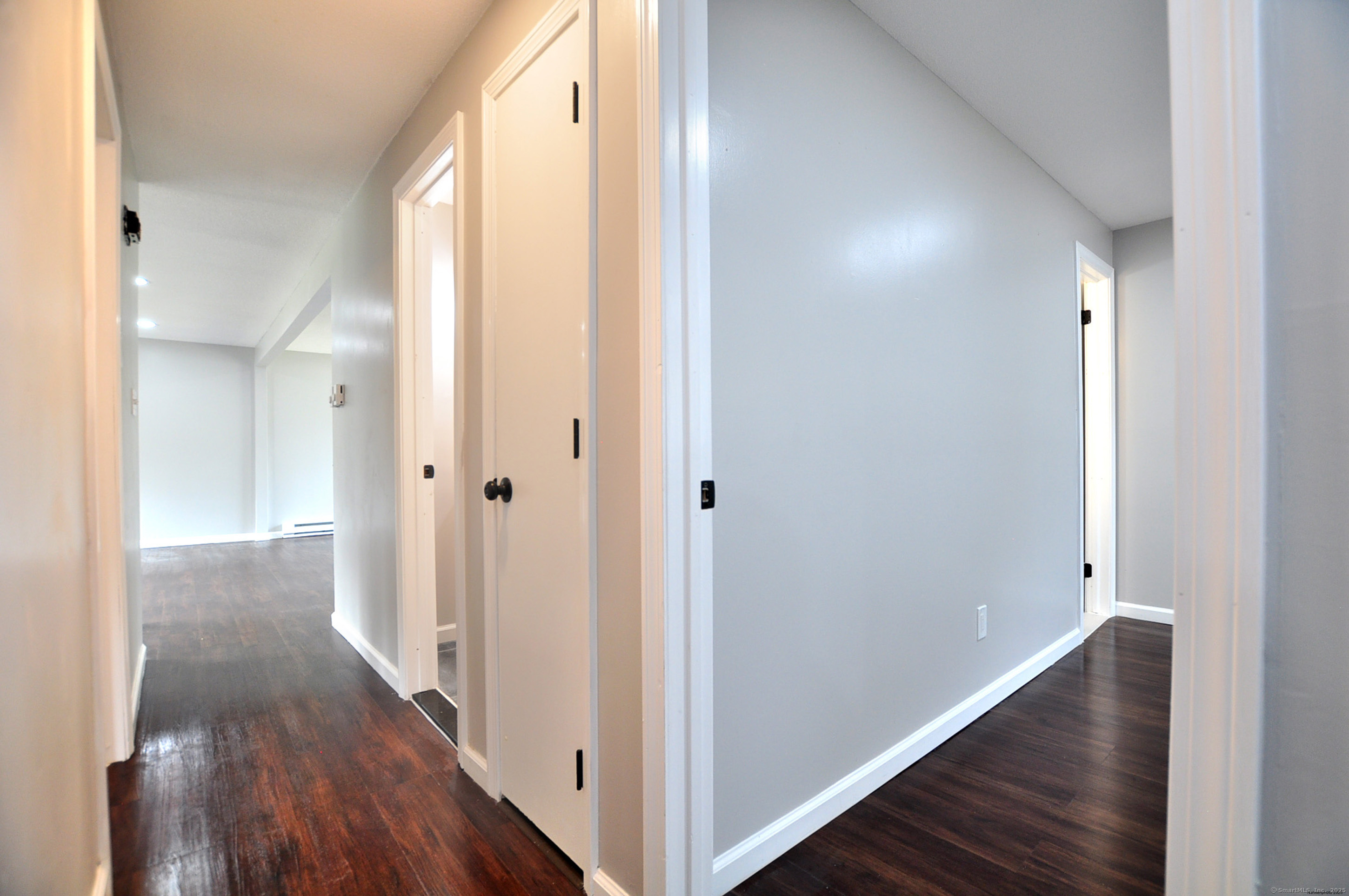 4 Kimann Drive Plymouth, CT 06786 - Photo 14 of 25 a view of a hallway with wooden floor
