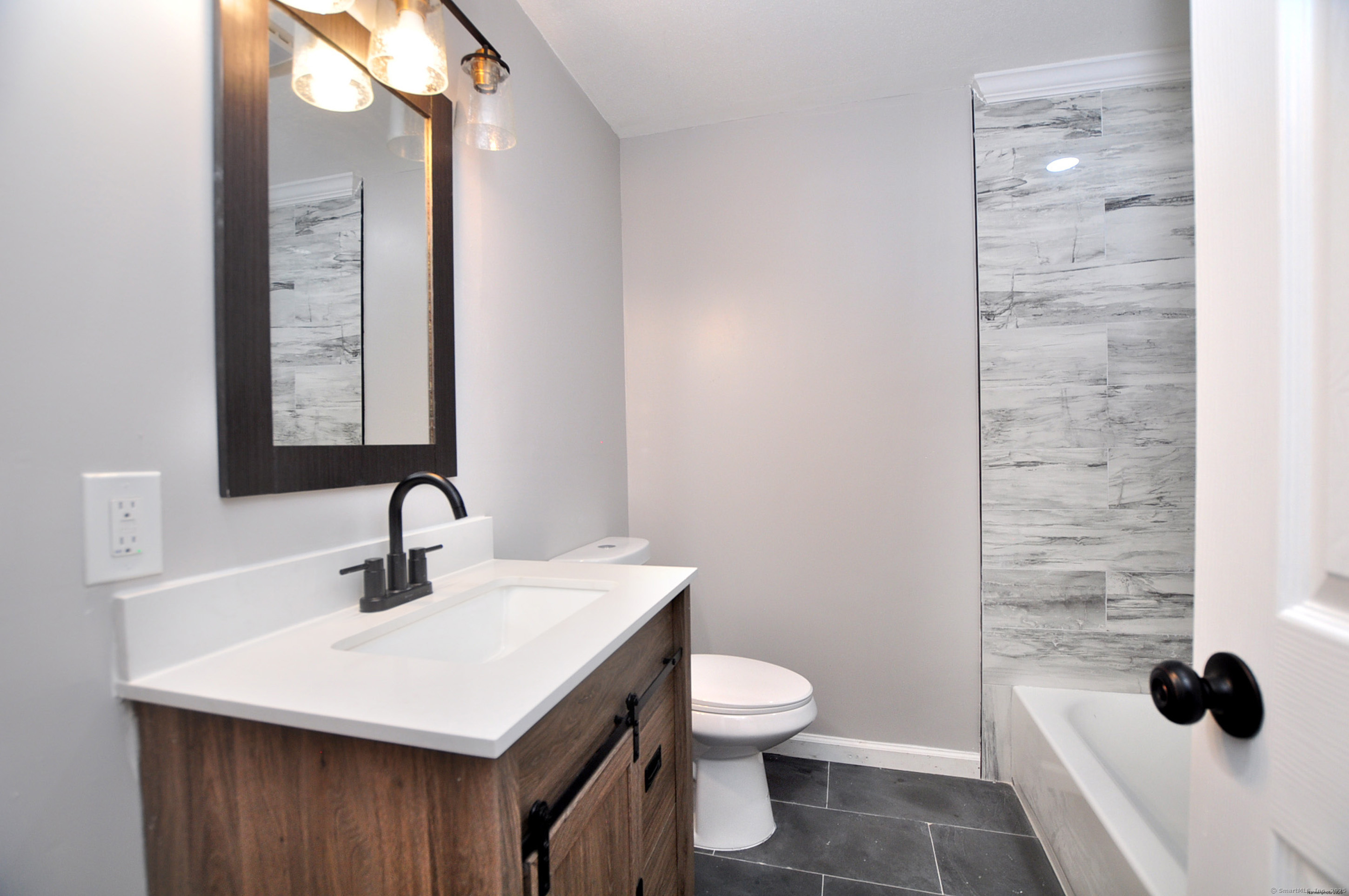 4 Kimann Drive Plymouth, CT 06786 - Photo 9 of 25 a bathroom with a sink toilet and mirror