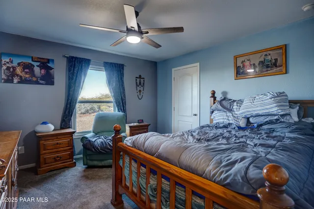 a bedroom with furniture and a window