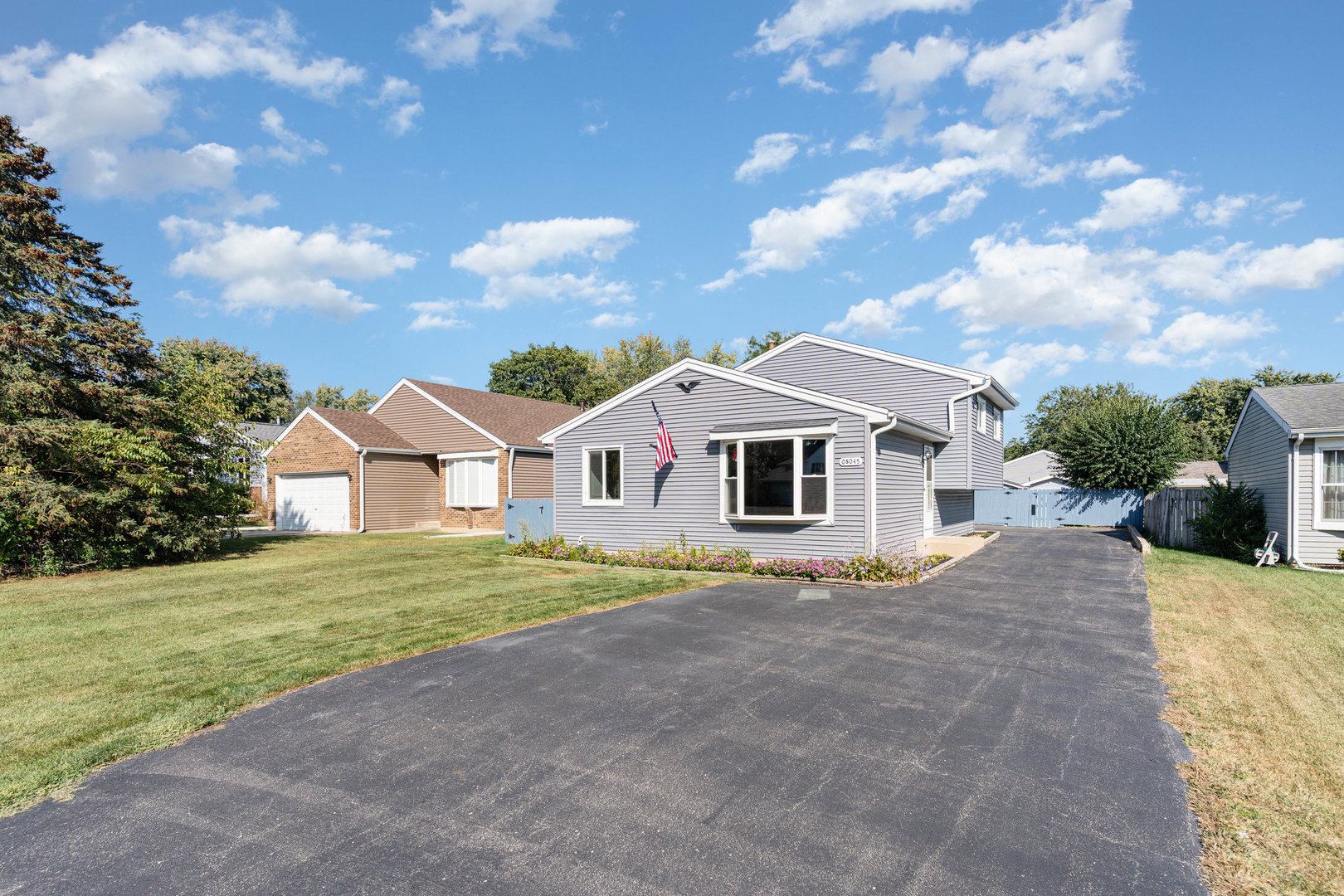 S045 Pleasant Hill Road Wheaton, IL 60187 - Photo 1 of 31 a front view of a house with a yard
