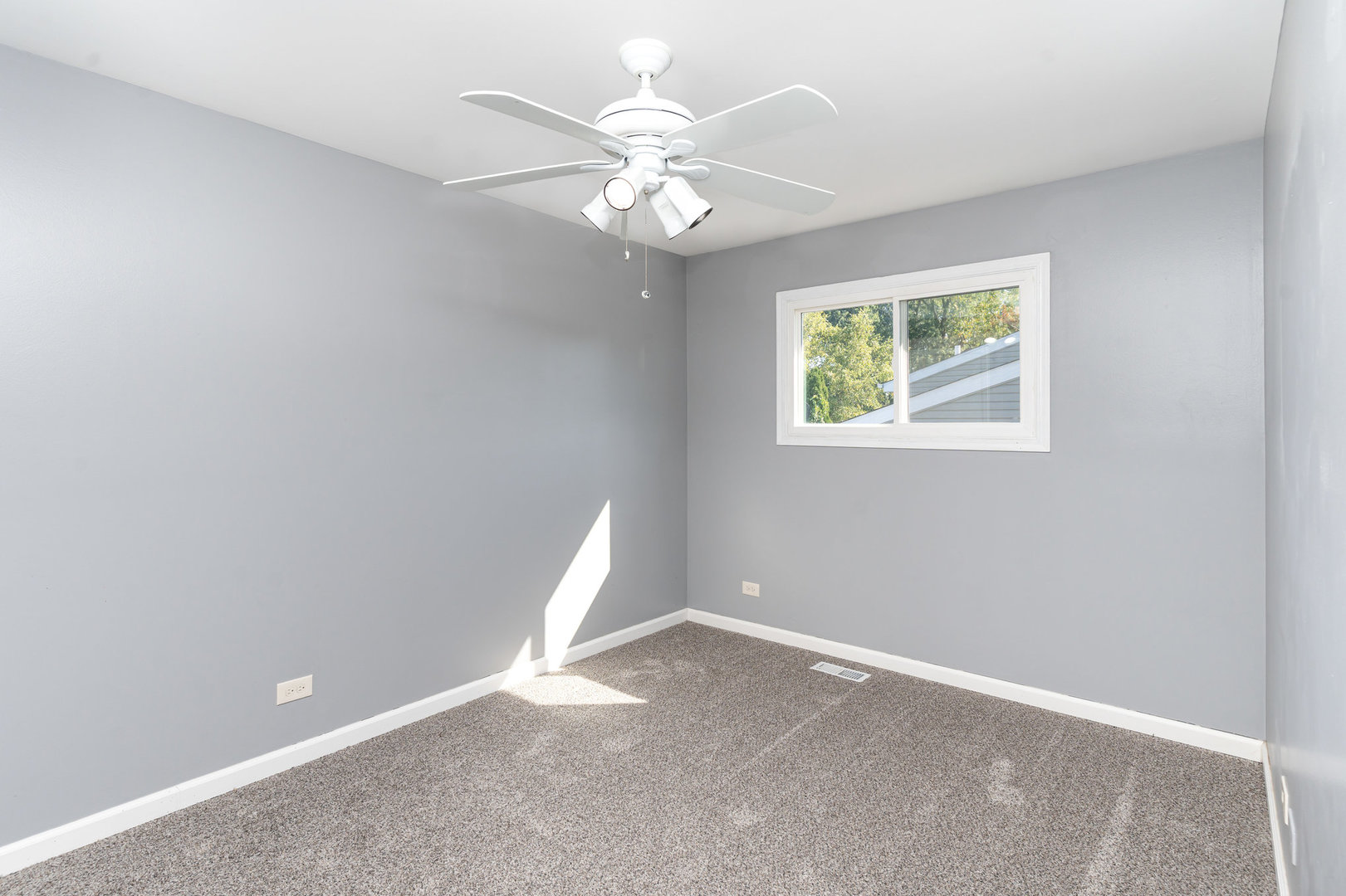 S045 Pleasant Hill Road Wheaton, IL 60187 - Photo 10 of 31 an empty room with a chandelier fan and windows