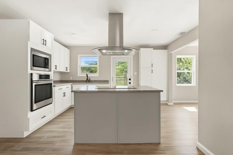 2116 Ridgeway Street Arlington, TX 76010 - Photo 11 of 21 a kitchen with stainless steel appliances a stove a sink and a refrigerator