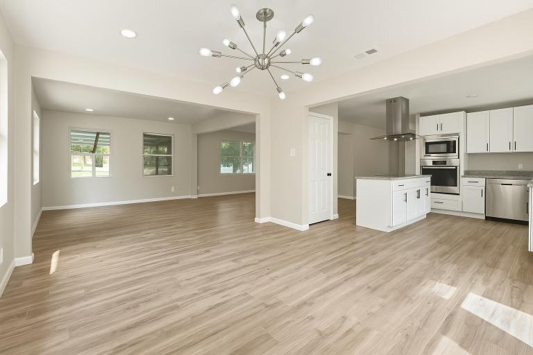 2116 Ridgeway Street Arlington, TX 76010 - Photo 7 of 21 a view of an empty room with a window and wooden floor