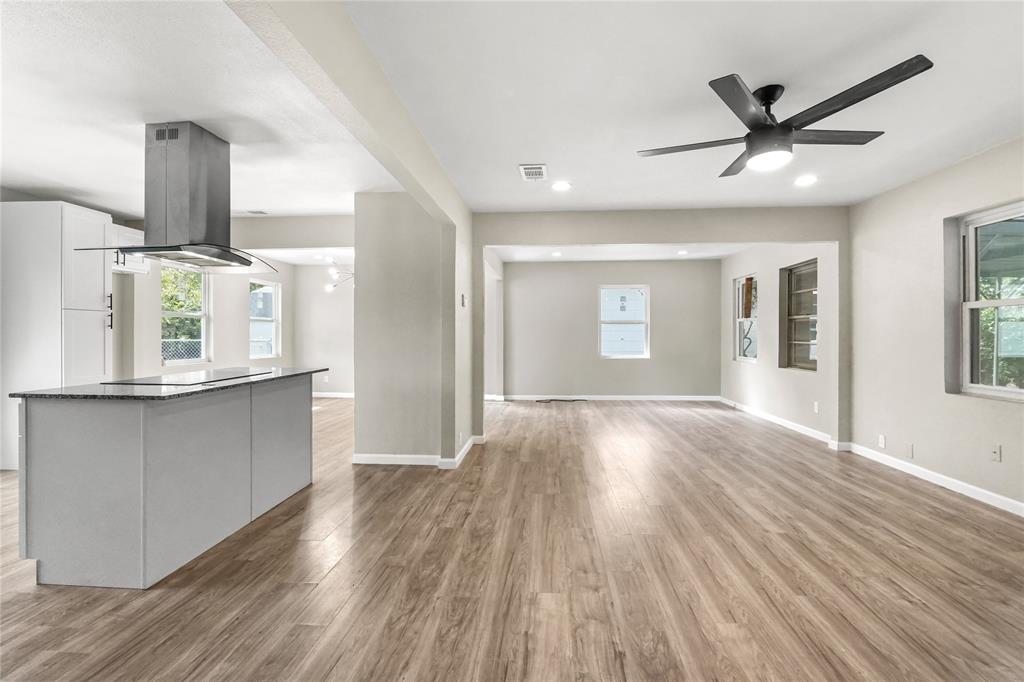 2116 Ridgeway Street Arlington, TX 76010 - Photo 10 of 21 a view of empty room with wooden floor and fan