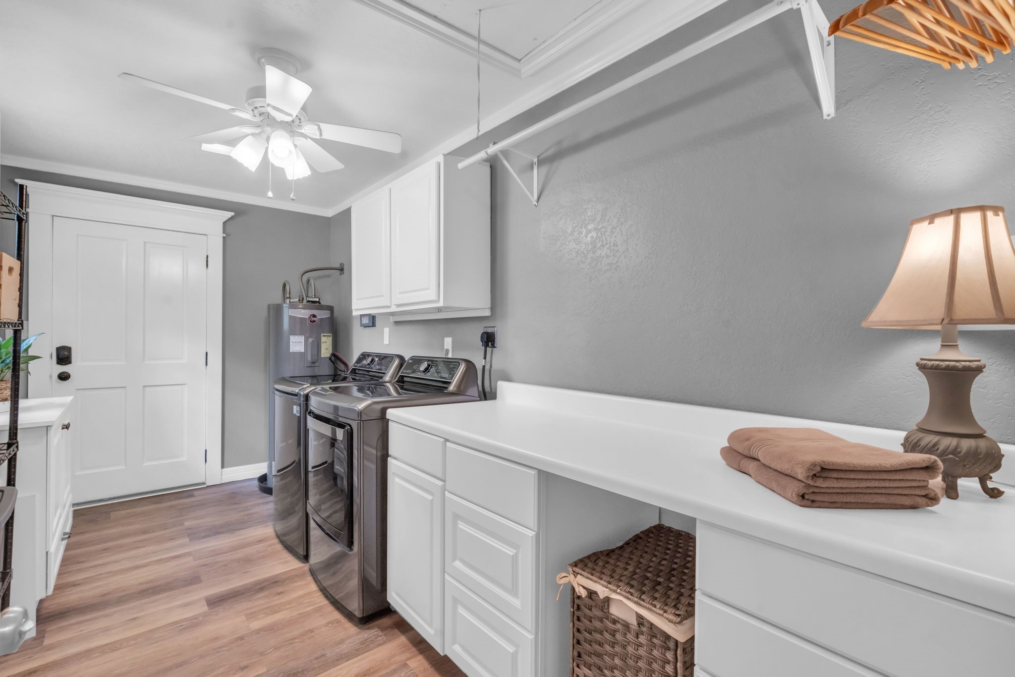 17821 Brown Road Conroe, TX 77306 - Photo 31 of 50 a kitchen that has a sink a stove and a wooden floor