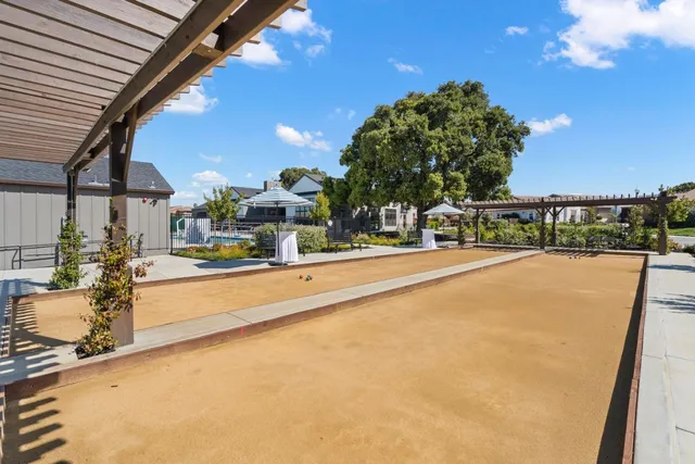 a swimming pool view with a outdoor seating