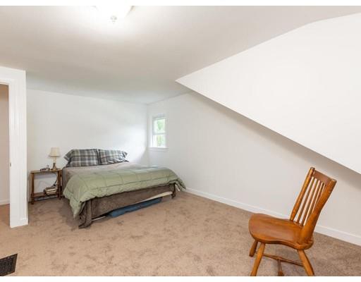 62 Hadley Road Merrimac, MA 01860 - Photo 12 of 23 a living room with a bed and a chair
