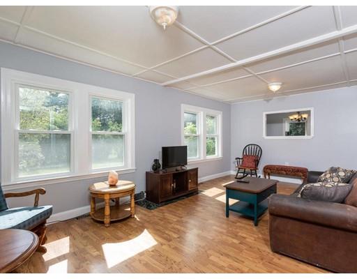 62 Hadley Road Merrimac, MA 01860 - Photo 4 of 23 a living room with furniture and a flat screen tv