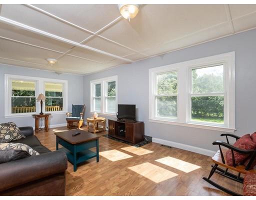 62 Hadley Road Merrimac, MA 01860 - Photo 5 of 23 a living room with furniture a flat screen tv and a window