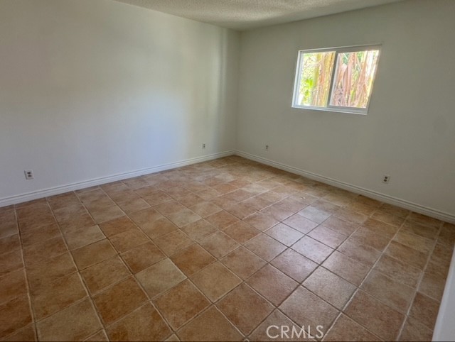 7514 Beckford Avenue Reseda, CA 91335 - Photo 14 of 20 a view of an empty room with a window
