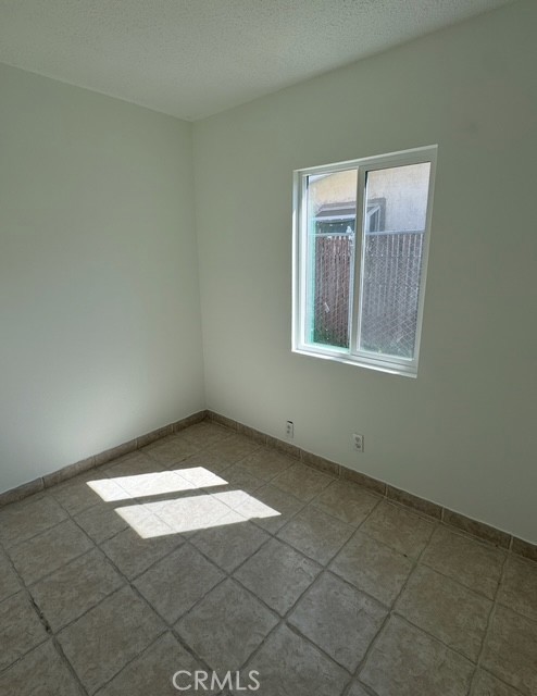 7514 Beckford Avenue Reseda, CA 91335 - Photo 15 of 20 an empty room with windows