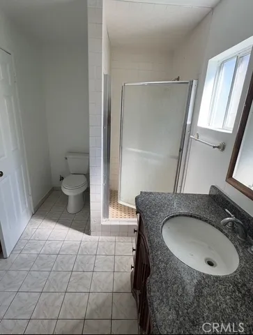 a bathroom with a toilet and a sink