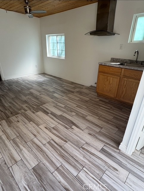 7514 Beckford Avenue Reseda, CA 91335 - Photo 19 of 20 a view of kitchen with granite countertop white cabinets stainless steel appliances a sink and a stove
