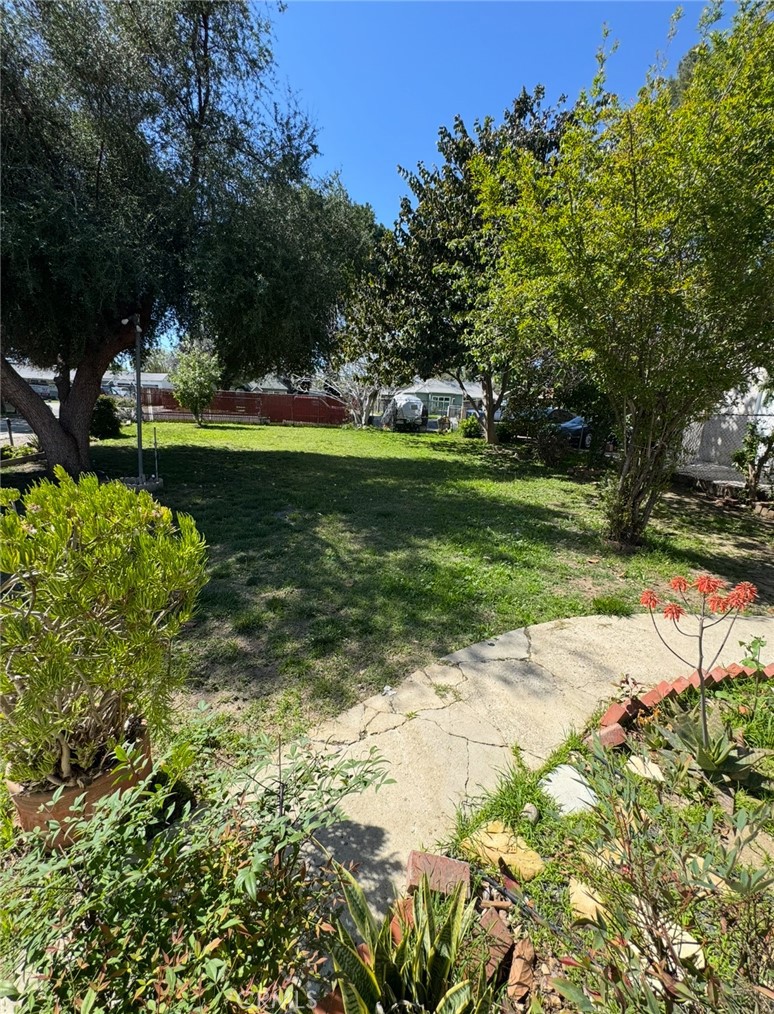 7514 Beckford Avenue Reseda, CA 91335 - Photo 3 of 20 a view of a park with large trees