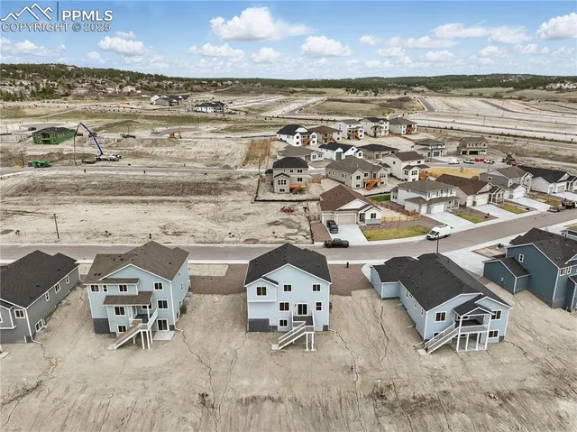 a kitchen with sink stove and refrigerator