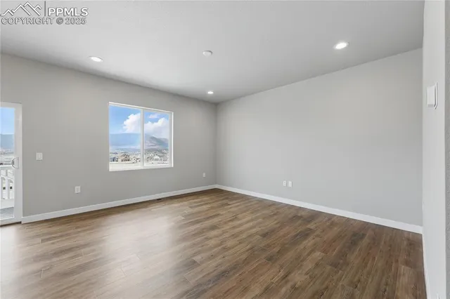 a bathroom with a granite countertop sink a toilet and a mirror