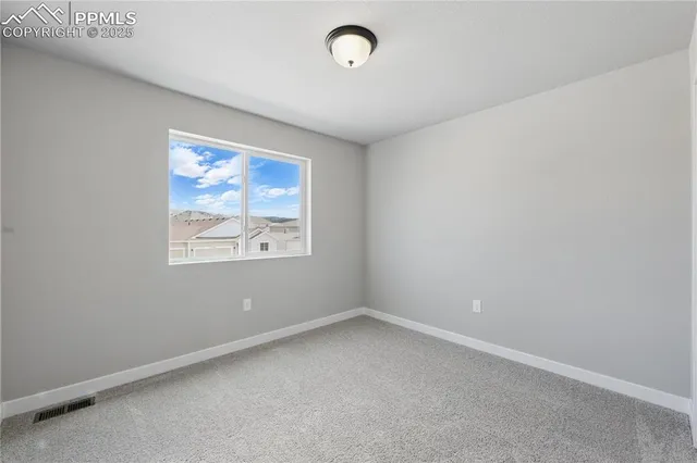 an empty room with a bathroom