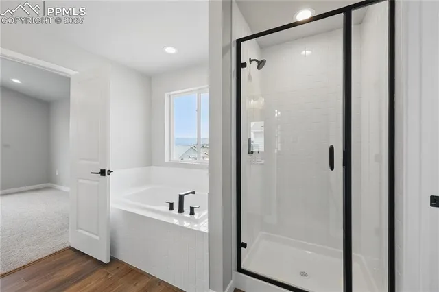 an empty room with windows and entrance to other room