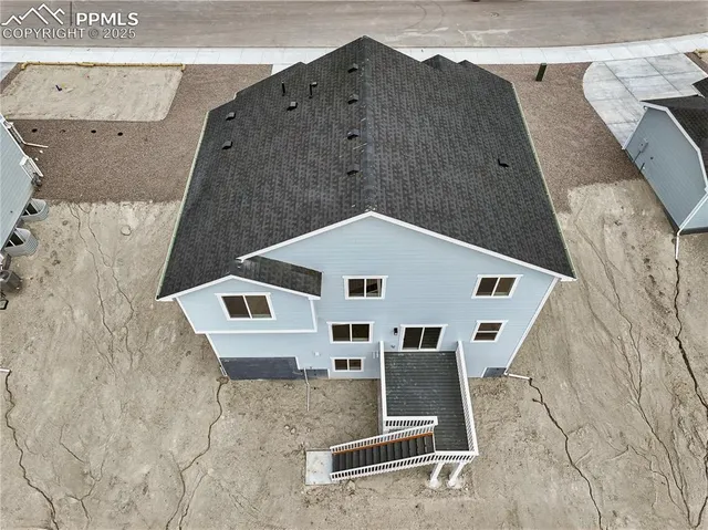 a kitchen with granite countertop a sink and cabinets