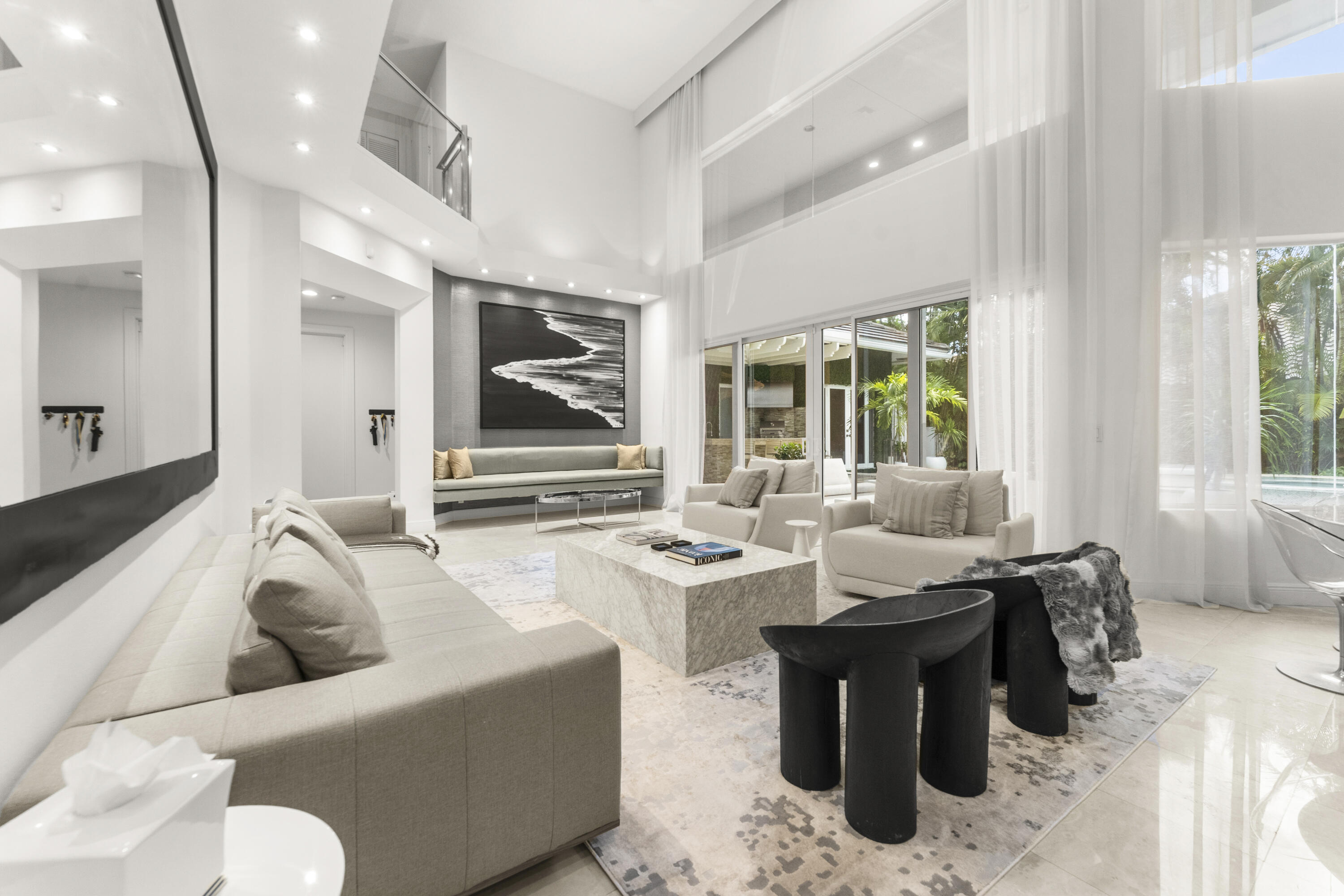 3156 Northwest 61st Street Boca Raton, FL 33496 - Photo 20 of 46 a living room with furniture and a large window