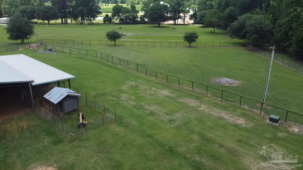 145 Tower Road Uriah, AL 36480 - Photo 52 of 72 a view of a table and chairs in the garden