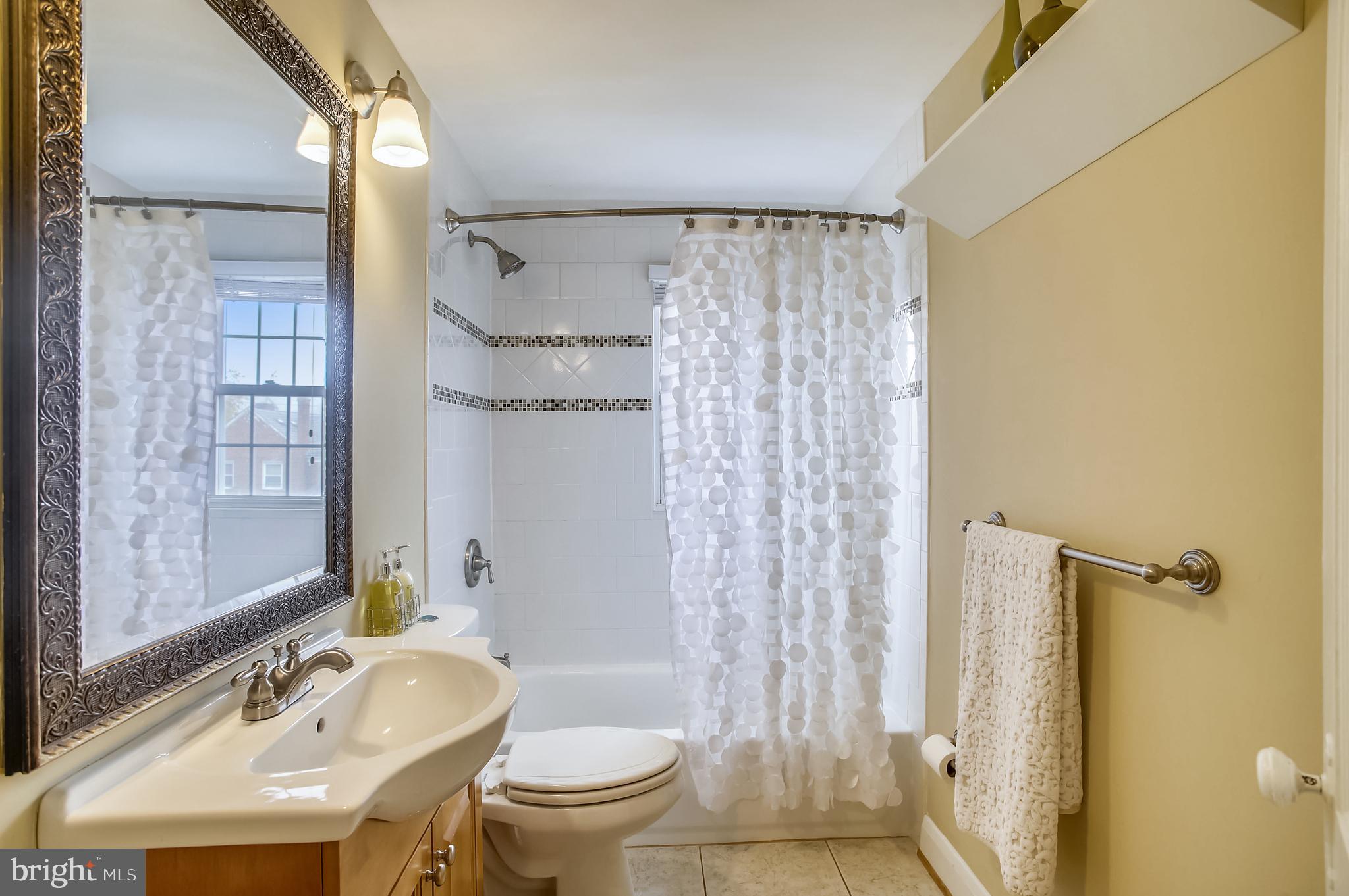1409 Langford Road Baltimore, MD 21207 - Photo 20 of 39 a bathroom with a sink toilet and shower