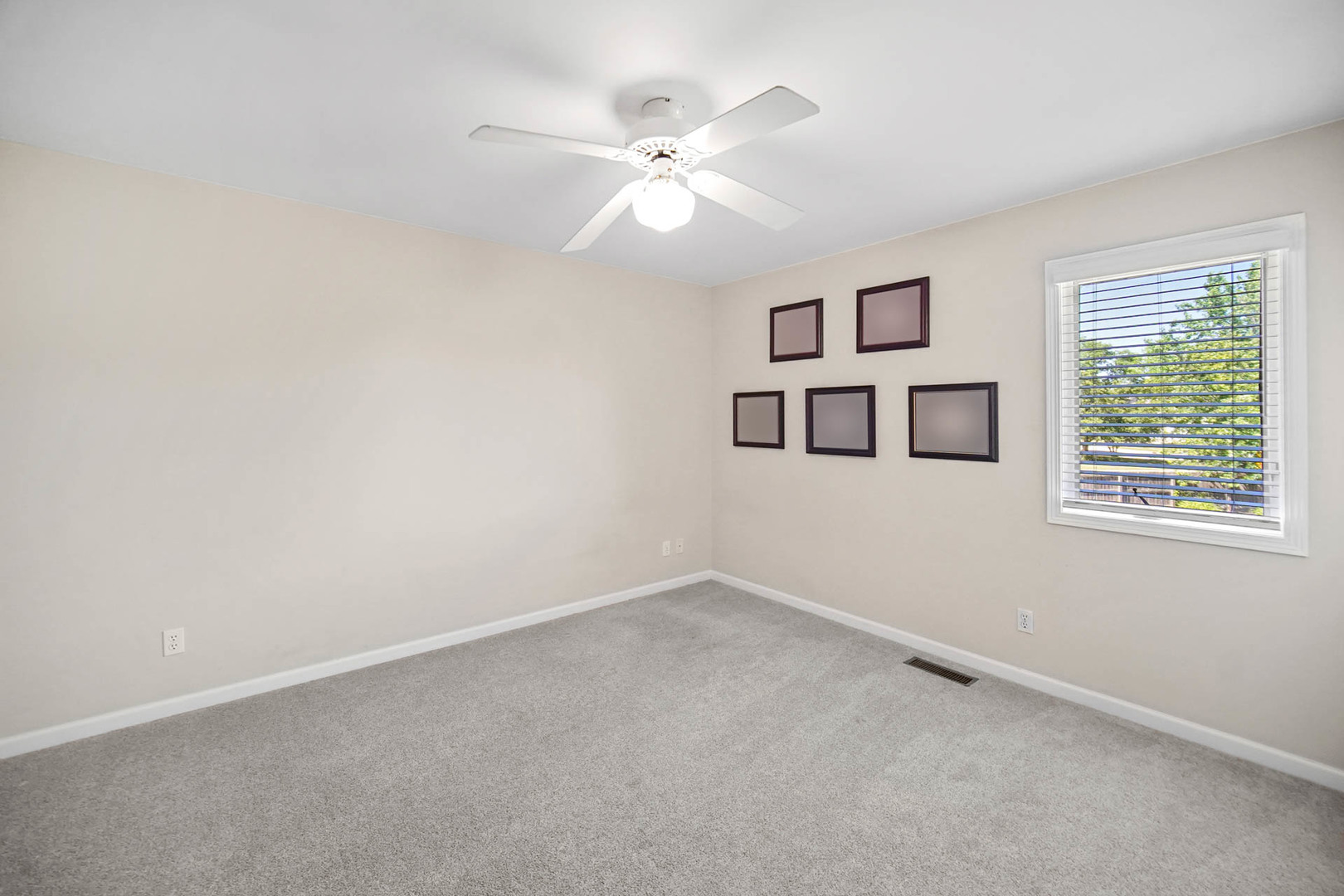 958 Willow Circle DeKalb, IL 60115 - Photo 27 of 35 an empty room with windows and ceiling fan