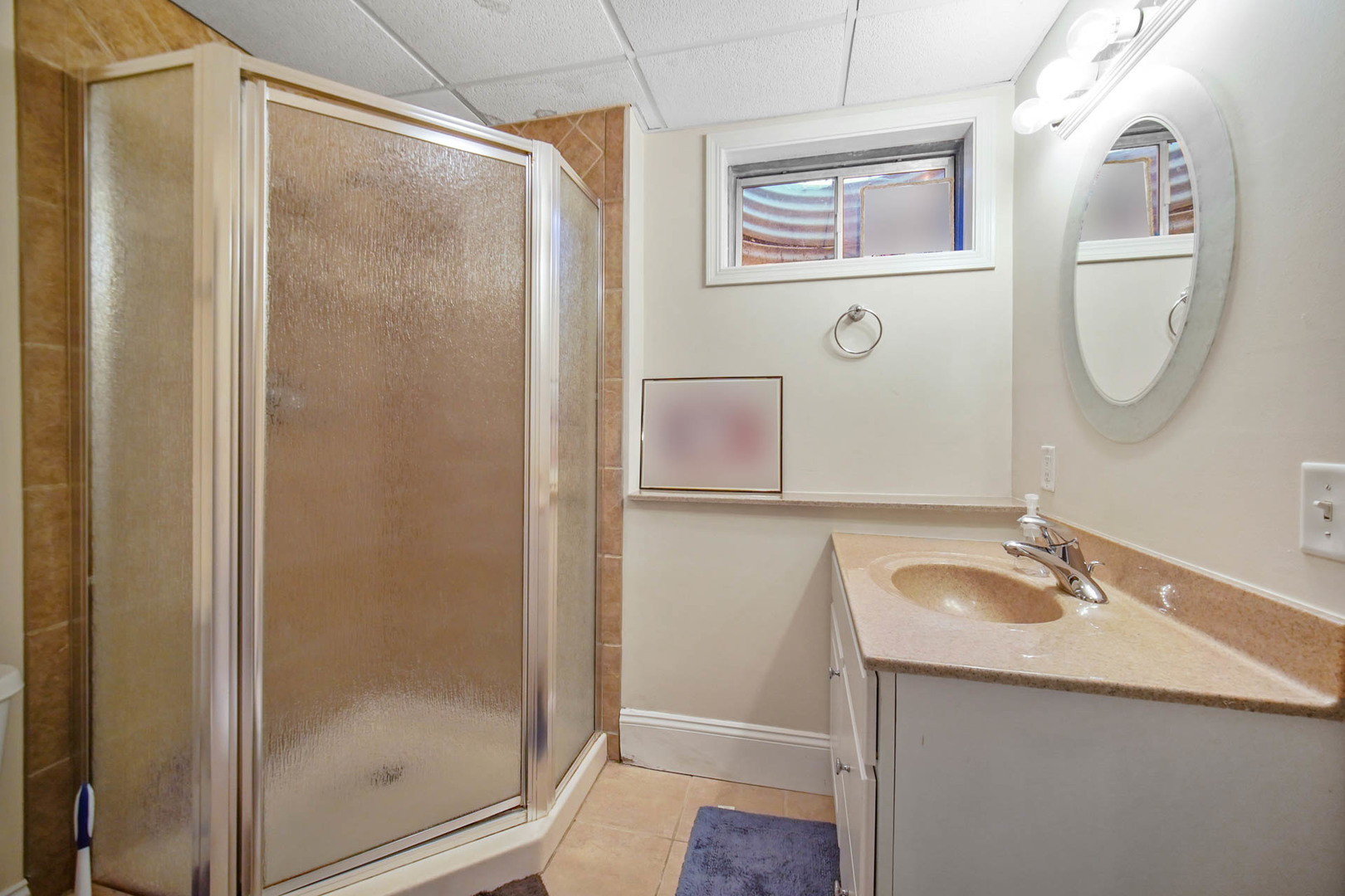 958 Willow Circle DeKalb, IL 60115 - Photo 33 of 35 a bathroom with a granite countertop sink mirror and shower