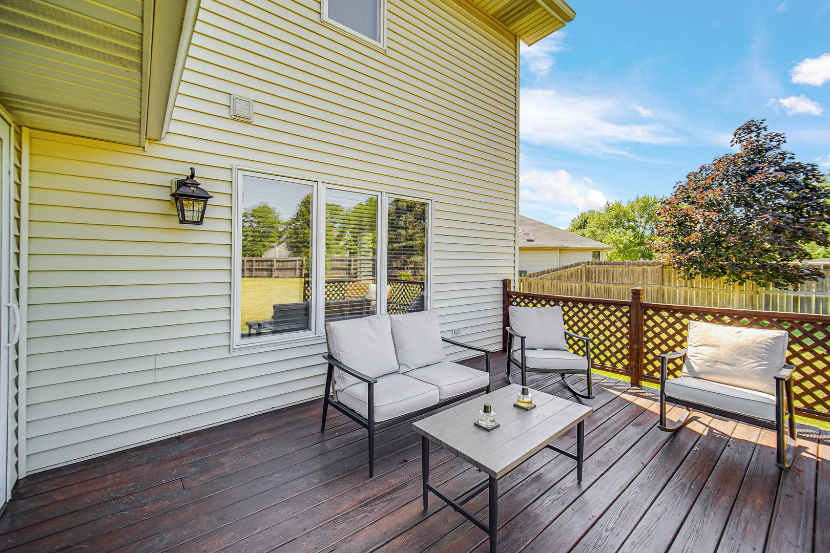 958 Willow Circle DeKalb, IL 60115 - Photo 8 of 35 a view of a roof deck with wooden floor and fence