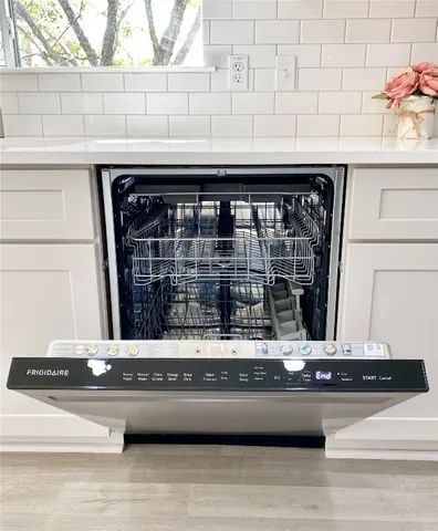 a view of a kitchen counter top a sink and a window