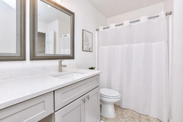 a view of a porch with furniture and a yard