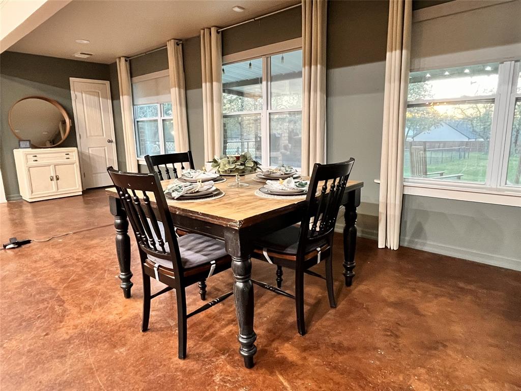 420 Sessums Road Springtown, TX 76082 - Photo 11 of 40 a view of a dining room with furniture and a window