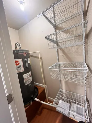 a kitchen with stainless steel appliances granite countertop a sink counter space cabinets and a fireplace