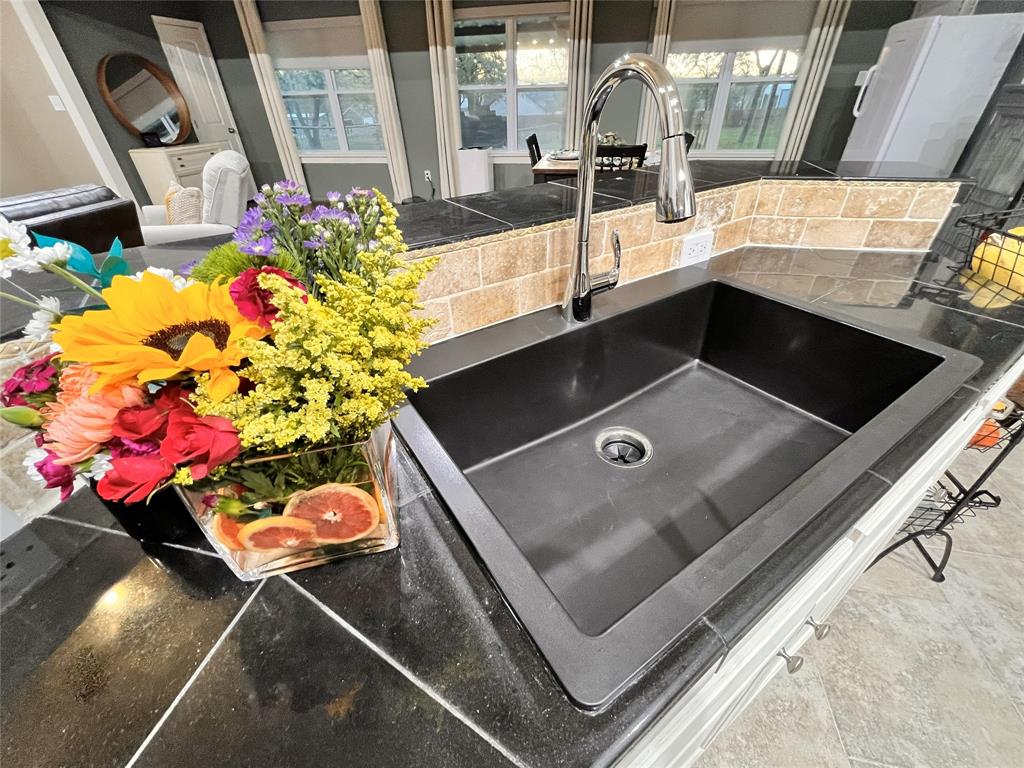 420 Sessums Road Springtown, TX 76082 - Photo 14 of 40 a view of living room with a sink and toys