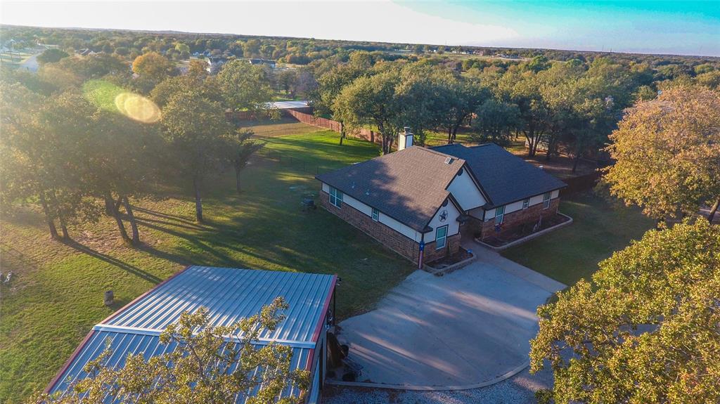 420 Sessums Road Springtown, TX 76082 - Photo 3 of 40 a view of a balcony with chair and table