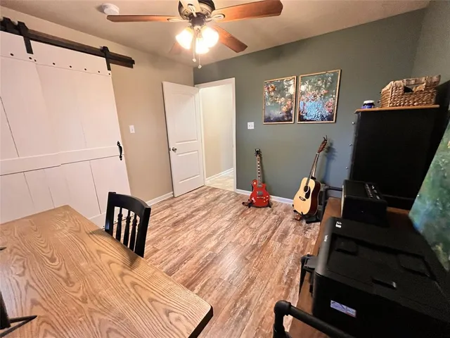 a room with furniture and wooden floor